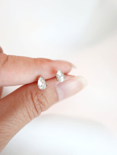 micro crystal pear studs in hand
