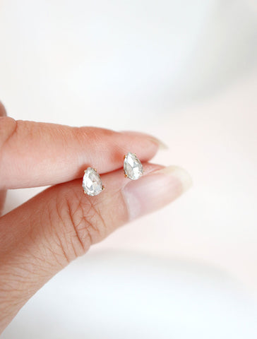 micro crystal pear studs in hand