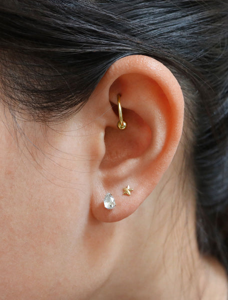 micro crystal pear stud earrings modelled