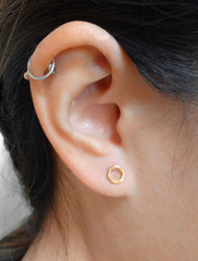 open hexagon earrings modelled