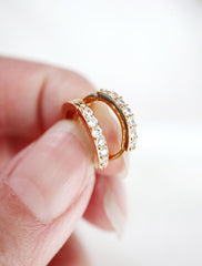 gold vermeil huggie hoops in hand