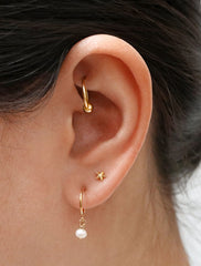 tiny pearl charm hoop earrings modelled