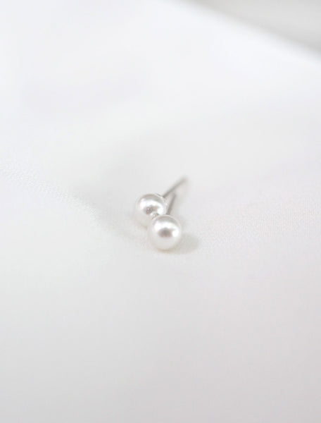tiny freshwater pearl studs close up