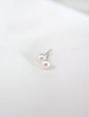 tiny freshwater pearl studs close up