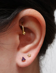 tiny amethyst triangle stud earrings modelled, february birthstone