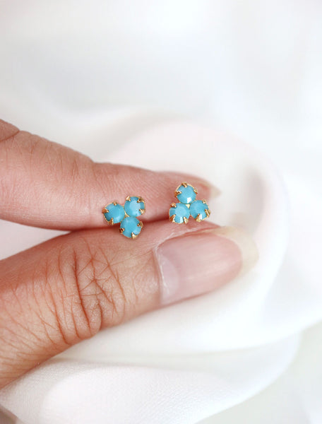 gold filled turquoise trefoil stud earrings in hand