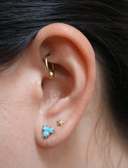 turquoise trefoil earrings modelled