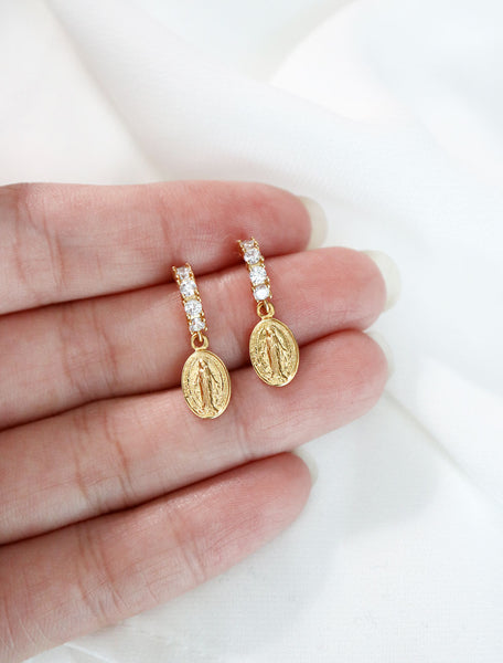 pave virgin mary hoop earrings in hand