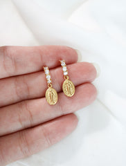 pave virgin mary hoop earrings in hand