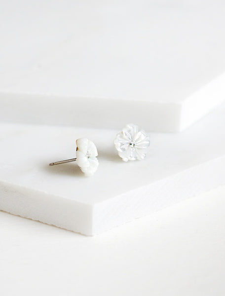 side view of carved mother of pearl flower studs
