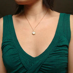 hibiscus . locket necklace