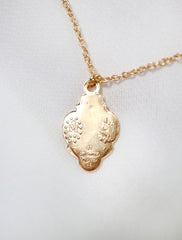 back of gold filled 3 way Catholic medal necklace