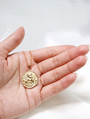 guardian angel medallion in hand
