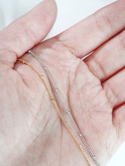 delicate satellite chain in hand