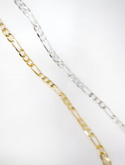 gold and silver thick figaro chain