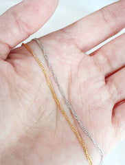 singapore chain necklaces in hand