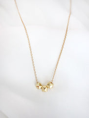 gold cubix necklace