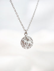 silver horoscope necklace hanging