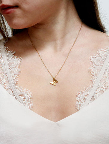 gold butterfly necklace worn
