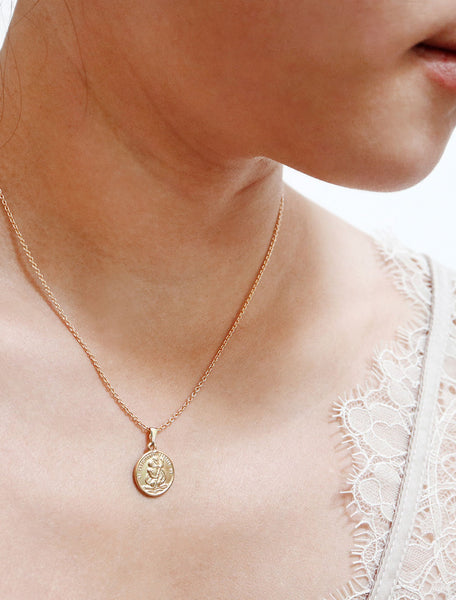 tiny st christopher coin necklace modelled