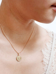 tiny st christopher coin necklace modelled