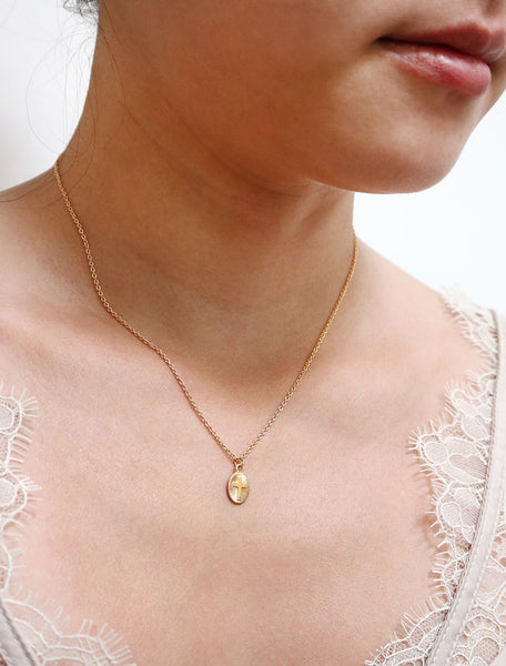 tiny starburst cross necklace modelled