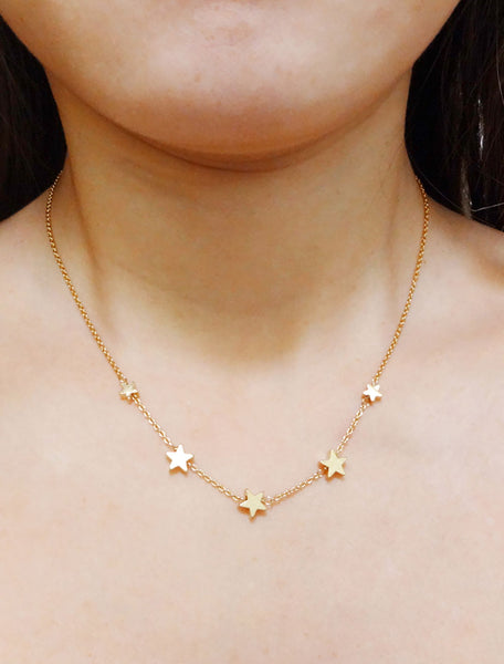 gold filled string of stars necklace modelled