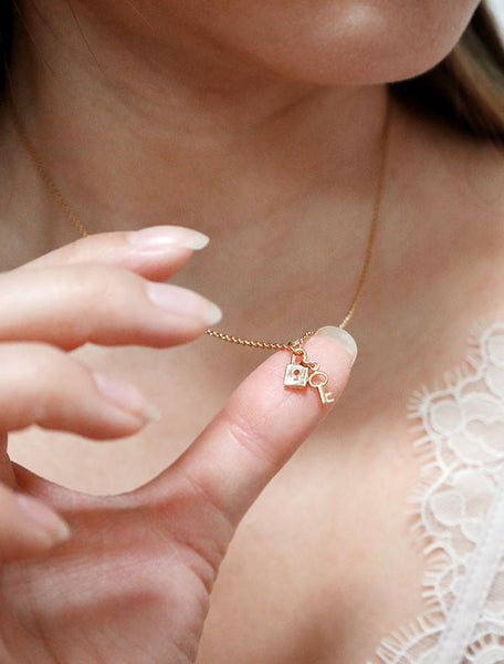 tiny lock and key necklace close up
