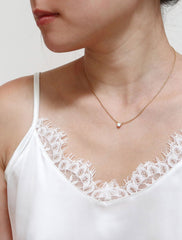 tiny opal necklace modelled