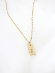 gold initial ribbon tag necklace