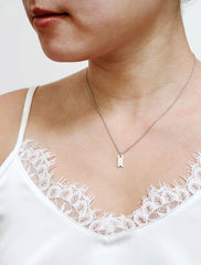 silver ribbon tag necklace modelled