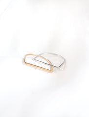 gold and silver D shaped bands