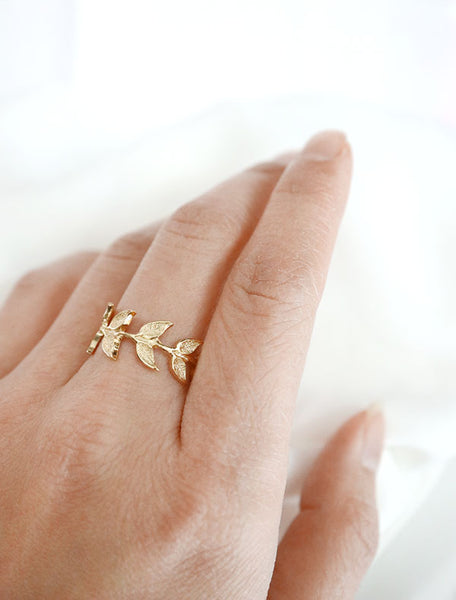 gold branch ring worn