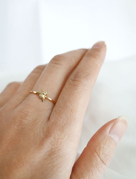 gold bee ring worn