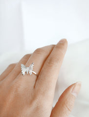 silver butterfly ring worn