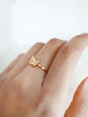 tiny gold butterfly ring worn
