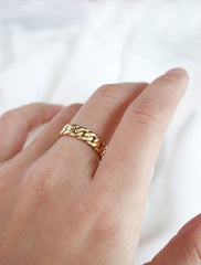 gold chain link ring worn
