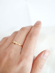 gold circle disc ring worn