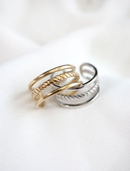 gold and silver cage rings