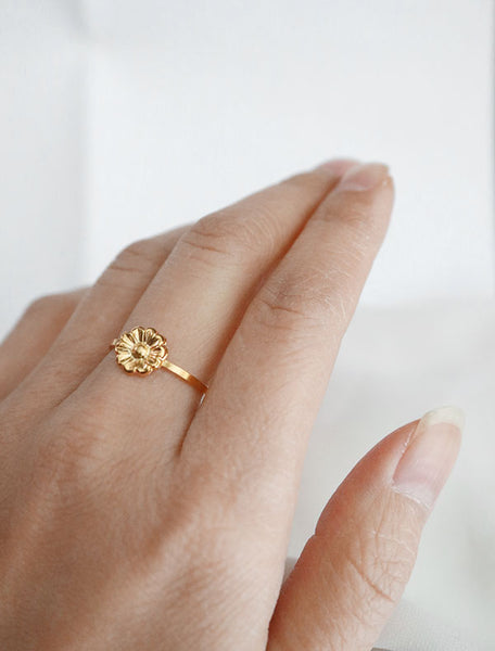 gold daisy stacking ring worn