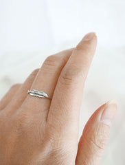 silver feather stacking ring worn