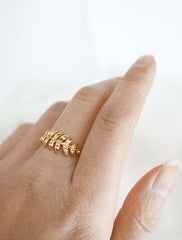 gold fern leaf ring worn