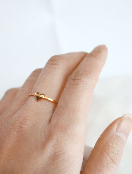 tiny gold heart ring worn