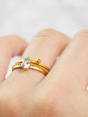 crystal teardrop ring stacked with a twist and sphere ring