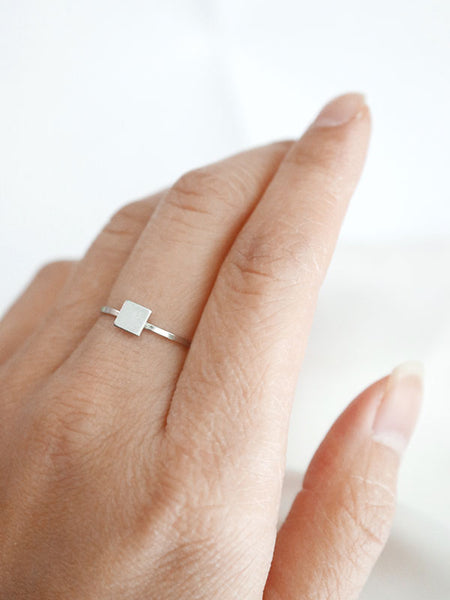silver square ring worn