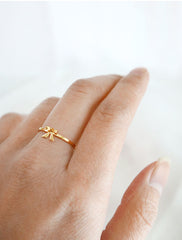 gold ribbon ring worn