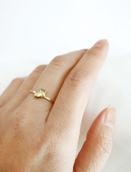 gold acorn ring worn