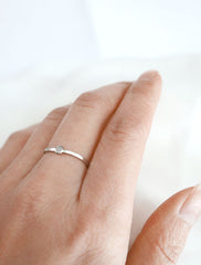 tiny silver disc ring worn