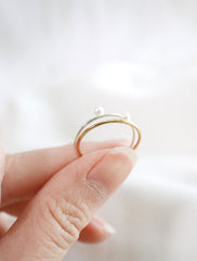 silver and gold pearl rings