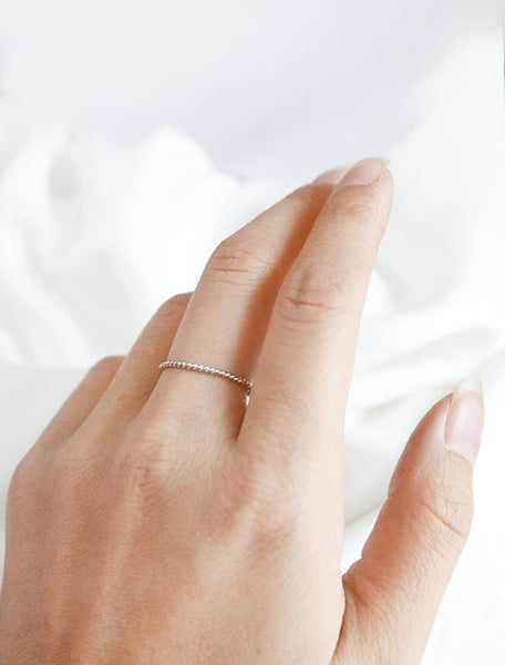 skinny twisted ring worn